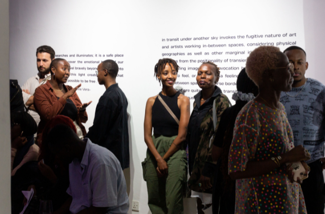 A crowd of people at an exhibition launch