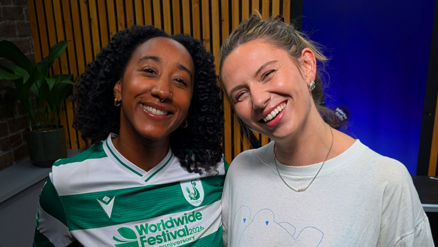 Two ladies in a studio, smiling.