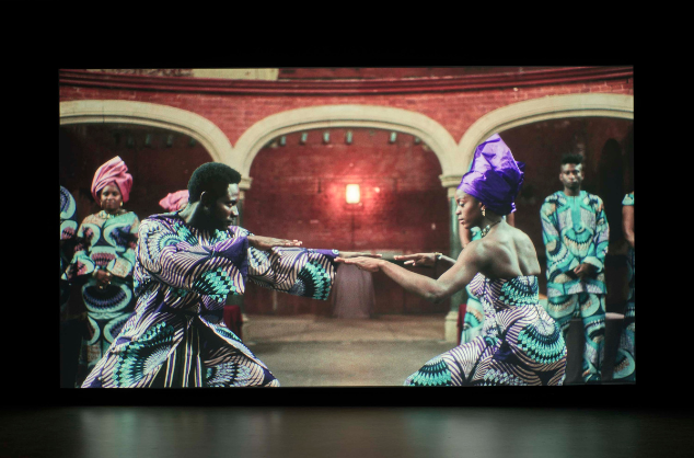 Projection on screen of dancers.