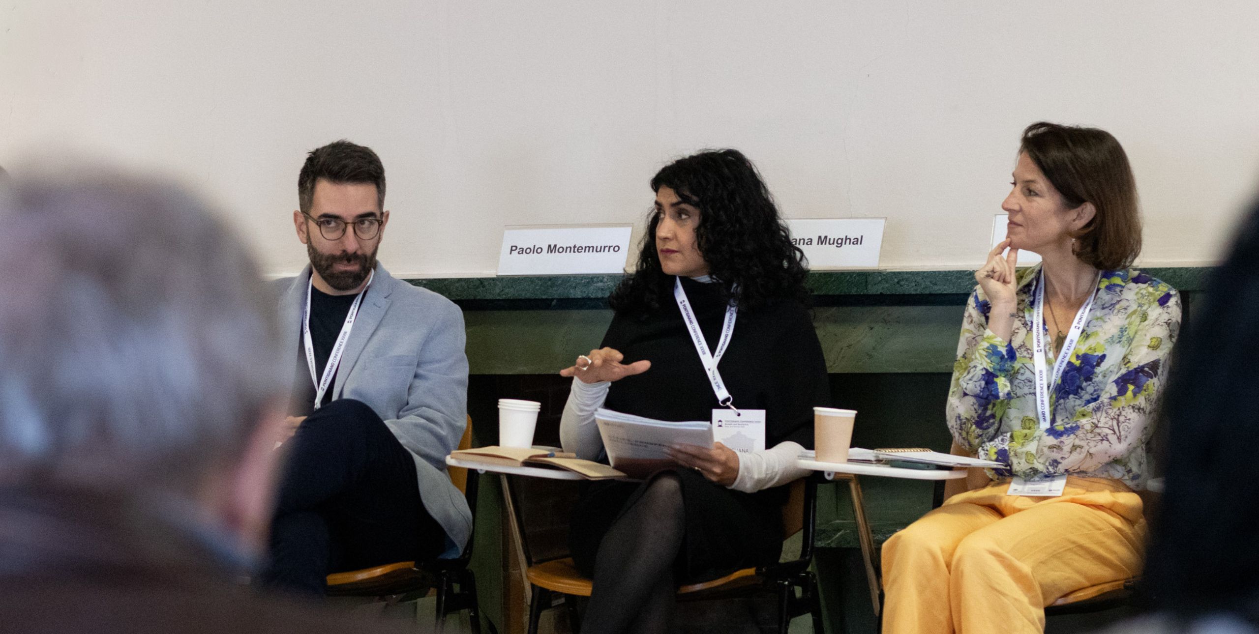 Three conference delegates sitting as part of a circle at a British Council workshop
