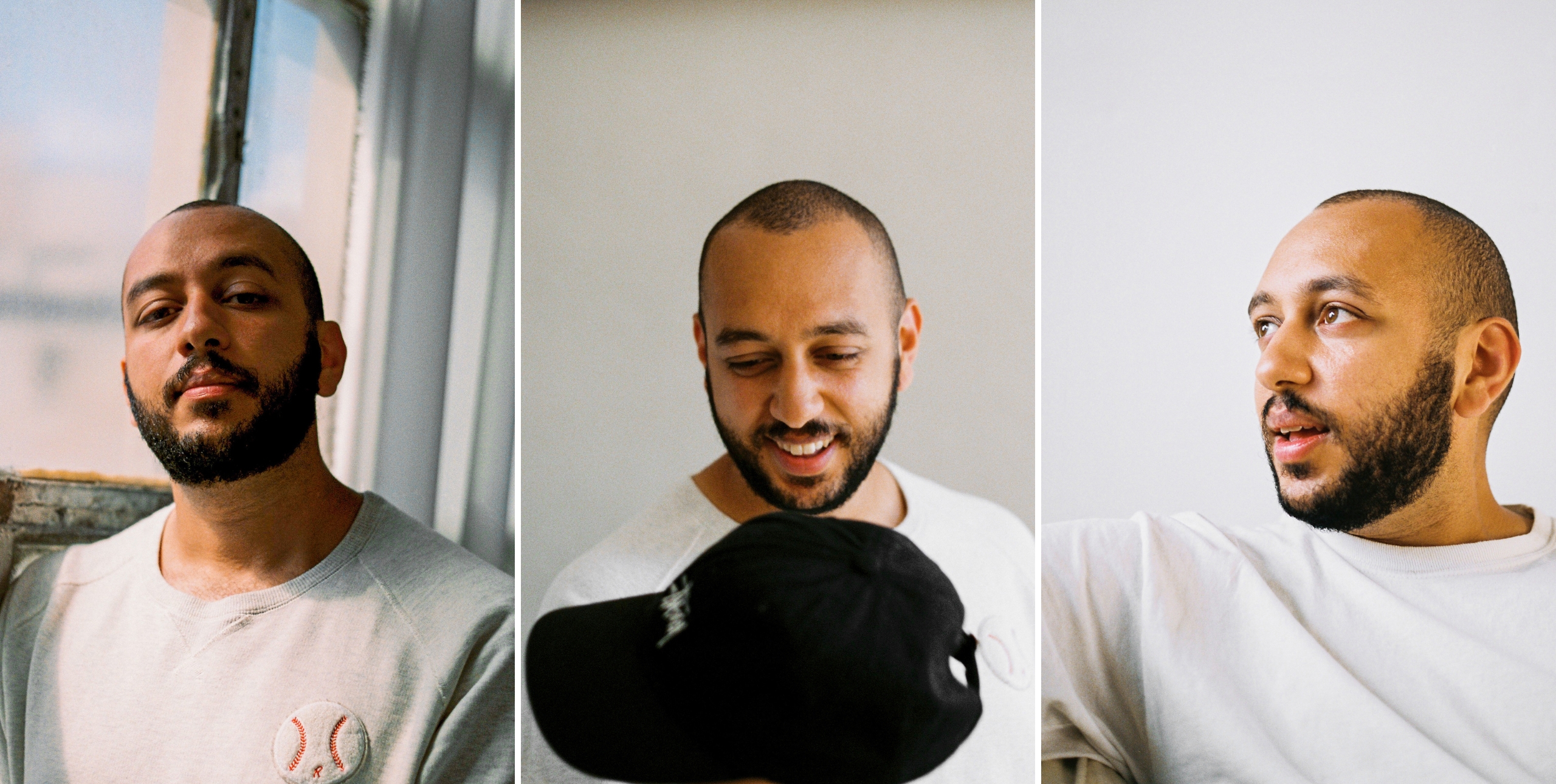 Three images of podcast host, Mo. (1) In front of a large window, looking towards camera (2) looking down, holding his cap, smiling (3) looking to our left.