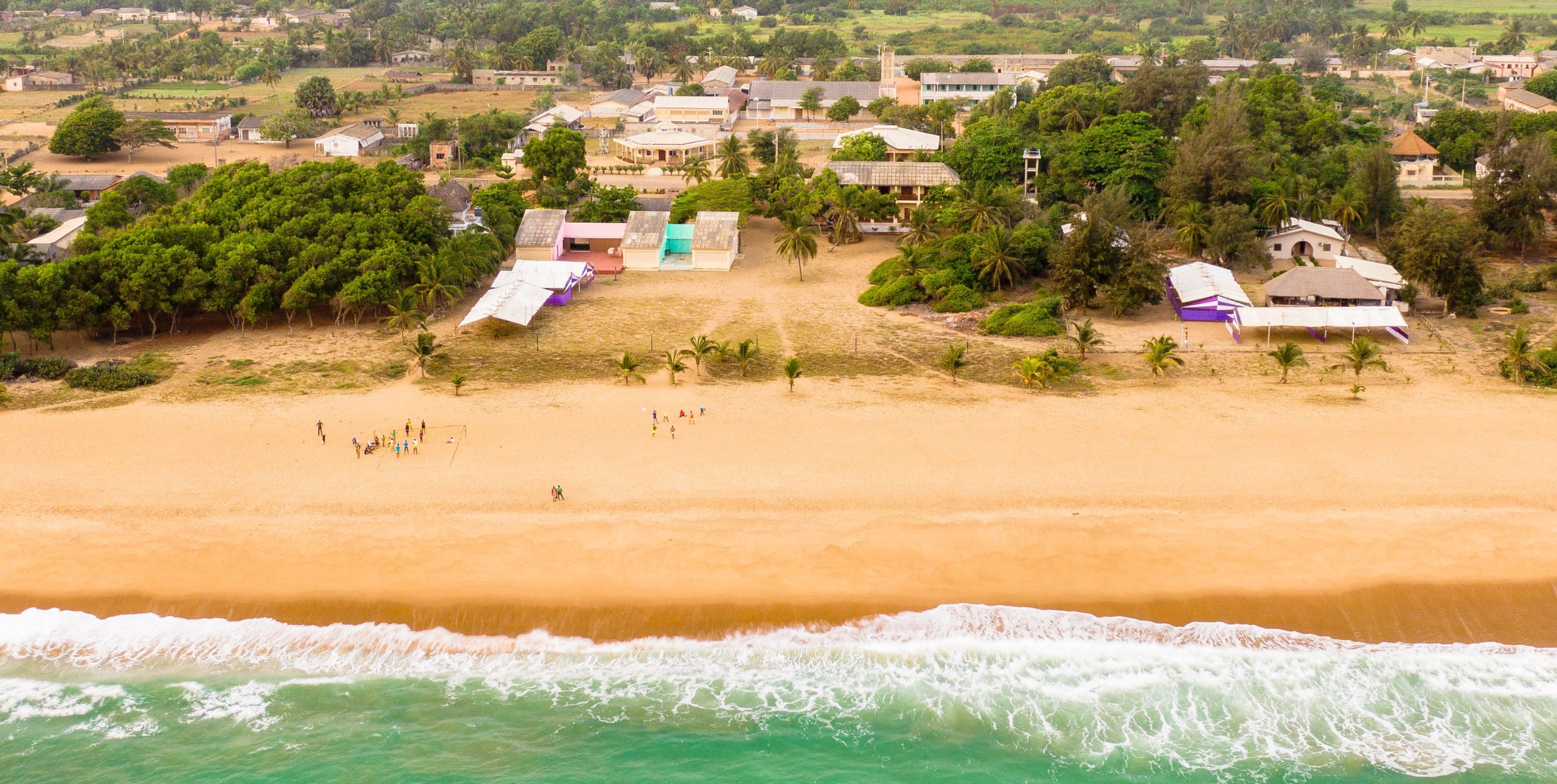 An aerial view of Villa Karo and the beach it is located on