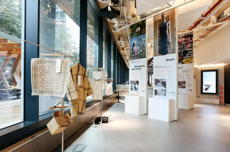 Exhibition including stands and clothes.