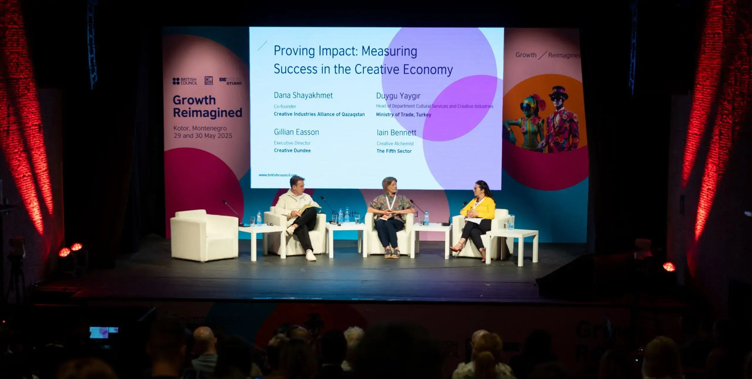 A panel of three people on a stage at the Growth Reimagined conference