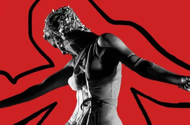 A woman in mask giving a physical drama performance