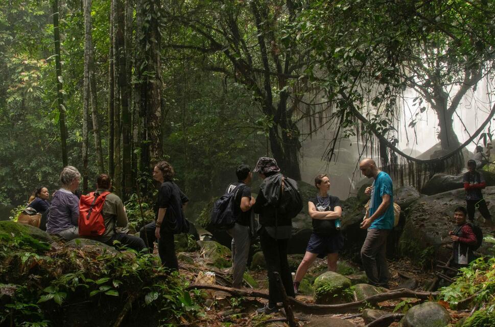 A group of people in a Malaysian jungle